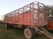 Acoplado jaula de 8 Mts de largo, con puerta guillotina, rodado 900.20 dual.